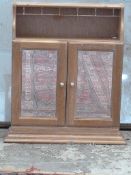 Light oak wall cabinet with bevelled glass mirror,