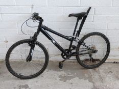 Child's black mountain bike with front suspension