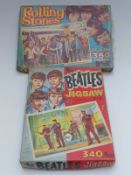 The Beatles jigsaw with green background in original box with a Rolling Stones jigsaw 'A Welcome
