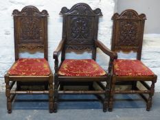 A set of ten (8 + 2) carved oak solid seat dining chairs