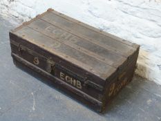 A vintage ash bound trunk with twin metal handles,