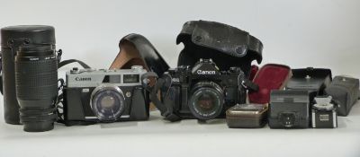 Canon A-1 SLR camera with 50mm 1:1:8 lens, Canon 75-200m 1:4:5 lens, Canon Coronet QL19 camera,