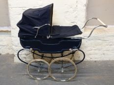 Pedigree vintage dolls pram in navy blue with hood and cover,