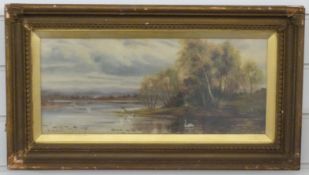 Oil on canvas lake scene with swans to foreground, signed and dated H.