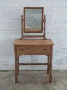 Limed oak mirror back dressing table with carved decoration,