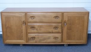 Retro Ercol light elm sideboard the three central drawers with sliding cutlery tray,