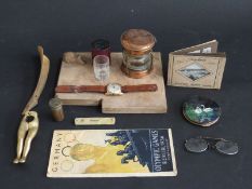 A collection of items including Mouseman style cheese board, Felea watch,