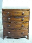 A small Victorian mahogany bow fronted chest of four graduated drawers,