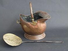 Copper helmet-shaped coal scuttle and a chestnut roaster