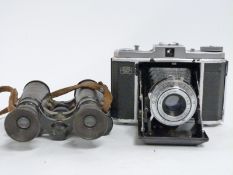 Zeiss Ikon Nettar folding camera together with an early 20thC pair of prismatic binoculars