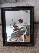 A bevelled edge mirror printed with flowers
