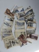 A quantity of Valentine and Sons aeroplane and other black and white postcards,