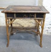 An oriental bamboo side table,