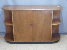 Art Deco style mahogany cupboard with shaped shelves to both ends,