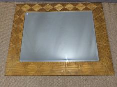 Harrison & Gill designer gilt framed mirror with bevelled glass and carved geometric frame,