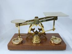 Waterlow & Sons Ltd, London 19thC brass postage or parcel balance or scales with weights to base,
