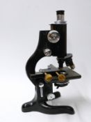 Cased Watson microscope with extra eyepieces