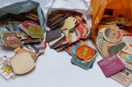 A collection of vintage beer and lager mats