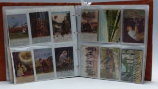 An extensive and varied postcard collection in a large four-ring binder,