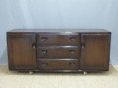 Retro Ercol sideboard of two cupboards flanking three drawers,