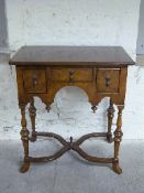 Queen Anne style walnut lowboy with oak drawer lining s and shaped cross stretcher uniting four