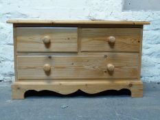Pine low chest of two over one drawers,
