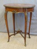 A 19thC French quarter veneered oval table with ormolu mounts,