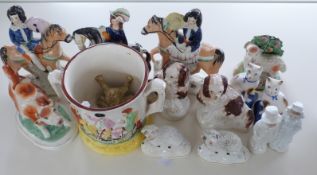 A collection of Staffordshire figures including early 19thC, lamb, frog mug,