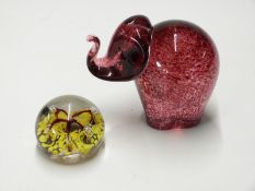 A large Wedgwood elephant paperweight and one other