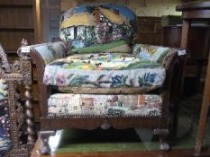 An Edwardian oak show wood framed bergere armchair