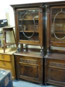 A glazed oak bookcase with cabinet under,