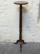 A mahogany torchere / jardiniere stand with rope twist design,