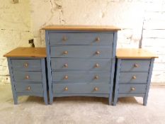A pair of painted bedside chests,