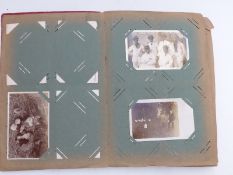 An album of approximately 130 early 20th century postcards to include Uncle Tom's Eastbourne