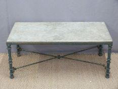 A marble topped wrought iron coffee table,