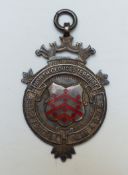 A hallmarked silver North Gloucestershire Association Football League fob,
