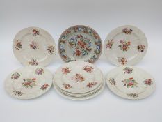 A collection of 19thC hand decorated relief moulded dessert plates and teaware marked 'New Scala