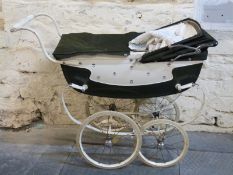 Silver Cross vintage dolls pram in white and dark green with fleur de lis decoration has hood and