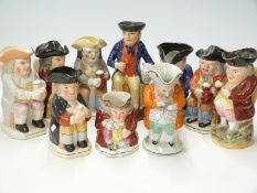 Ten 19th / 20thC Toby jugs including foaming quart and taking snuff