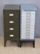 Two small metal filing cabinets
