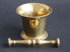 An 18thC/19thC bronze or brass pestle and mortar