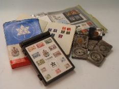 An album of first day covers, a Canada centenial commemorative stamp box,