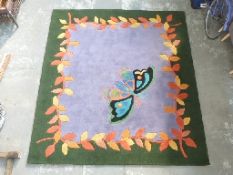 Modern rug with large butterfly motif,