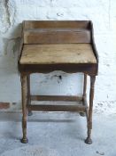 A 19th/20thC elm child's desk,