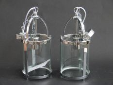 A pair of Art Deco style cylindrical light fittings,