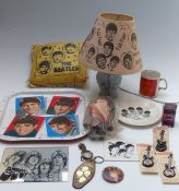 The Beatles collectibles to include cushion, mirror, table lamp with shade, badges,