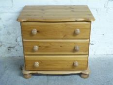 Small pine chest of three drawers,