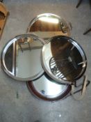 Four mirrors including a leather and chrome framed examples