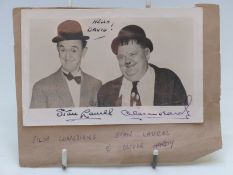 Stan Laurel and Oliver Hardy black and white photograph with dedication 'Hello David' and