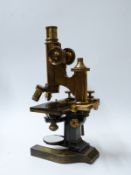 E Leitz Wetzlar cased microscope with various extra lenses